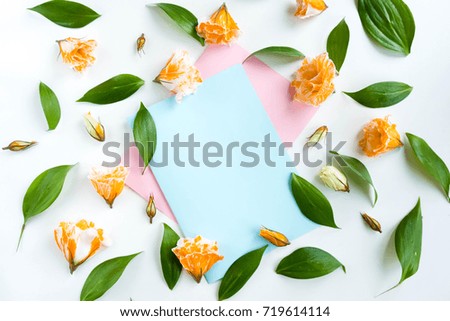 Mockup with clipboard, beige roses. Flat lay, top view. Empty frame and flowers on blue and pink pastel background with copy space. Soft effect filter
