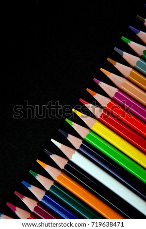 Color pencils on black background