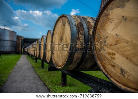 Bourbon barrels at a distillery along the Bourbon Trail in Kentucky.  Royalty-Free Stock Photo #719638759