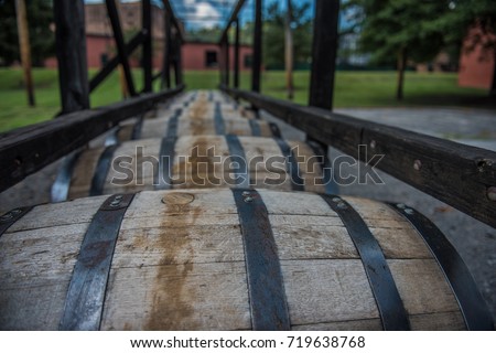Bourbon barrels at a distillery along the Bourbon Trail in Kentucky.  Royalty-Free Stock Photo #719638768