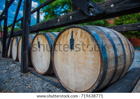 Bourbon barrels at a distillery along the Bourbon Trail in Kentucky.  Royalty-Free Stock Photo #719638771