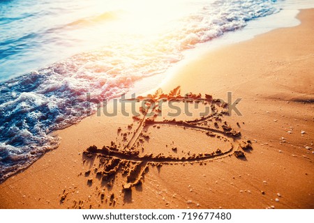 Image of icon bitcoin on golden sand, in background sea sun light. Concept freelance, stock exchange
