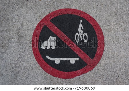 No skating, rollerblading or riding sign on the ground