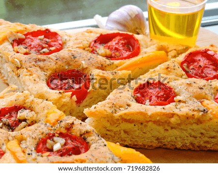 Focaccia slices with cherry tomatoes. Close up.	