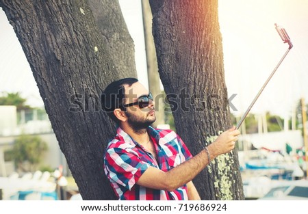 man with beard taking selfie picture