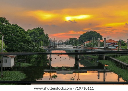 beautiful of Sunset sky with river landscape and bridge and road and walkway riverside in Bangkok, Thailand