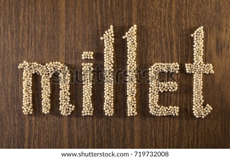 The sign "millet" made on the table out from millet, Russia