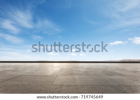 empty marble floor and snow mountains in blue cloud sky Royalty-Free Stock Photo #719745649