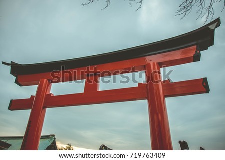 Torii is traditional Japanese Gates Path of Fushimi Inari-taisha Shrine, Kyoto, Japan, it symbolically marks the transition from the profane to the sacred.