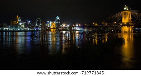 The Cincinnati skyline sits behind the Roebling suspension bridge.