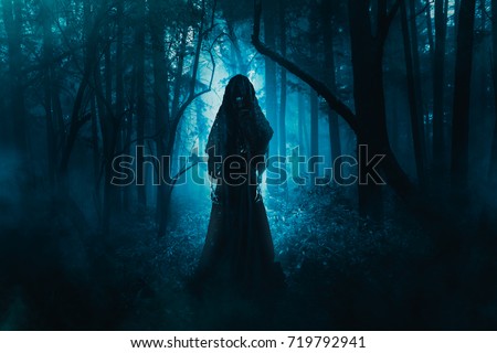 High contrast image of a scary ghost in the woods Royalty-Free Stock Photo #719792941