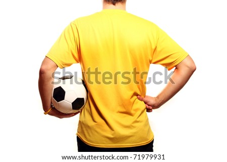 A picture of a young footballer in a yellow t-shirt with a football over white background