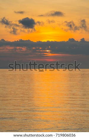 Light and orange sea at sunset