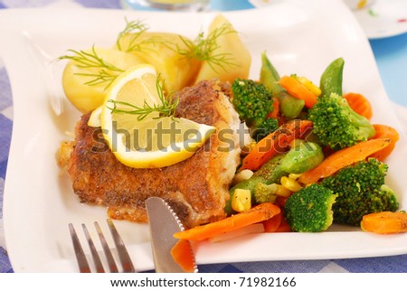 fried halibut fish with vegetables and potato for dinner