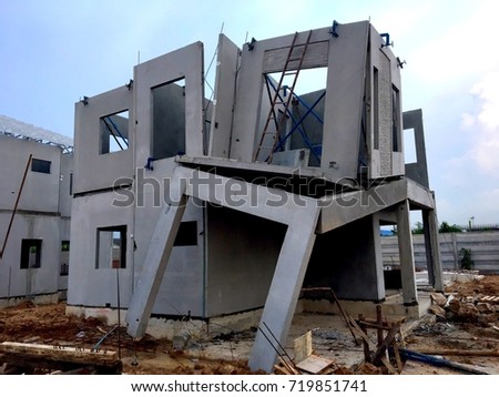 Damaged home construction,architecture detail of damaged house corner dilapidated Construction is not standard  over blue sky background. Unfinished private residences. Royalty-Free Stock Photo #719851741
