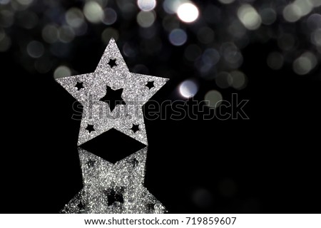 beautiful shiny Christmas star on a black background