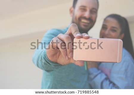 Young couple doing selfie. Young sport couple doing selfie on street.