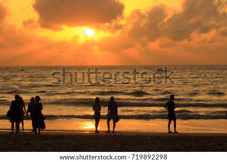 the romantic landscape of sunset of the tropical sun on the coast of the Indian ocean beyond the horizon