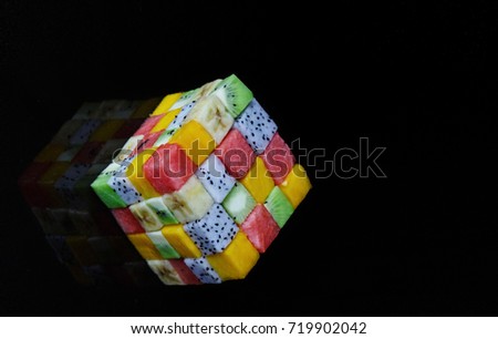 3d cube of fruit isolated on a black background