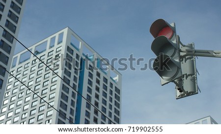 Traffic light changes from red to greent In The City. Traffic light In The City