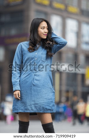Picture of One beautiful young Chinese woman outdoor in the street