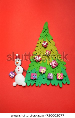 Christmas tree from plasticine on a white background. Hand made plasticine tree