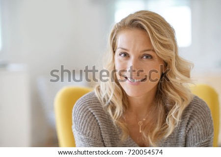 Portrait of beautiful 40-year-old blond woman  Royalty-Free Stock Photo #720054574