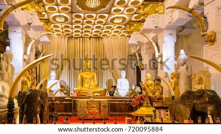 Sitting Buddha statue in Temple of the Tooth. Kandy, Sri Lanka Royalty-Free Stock Photo #720095884