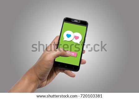Online dating sceen on phone background Royalty-Free Stock Photo #720103381