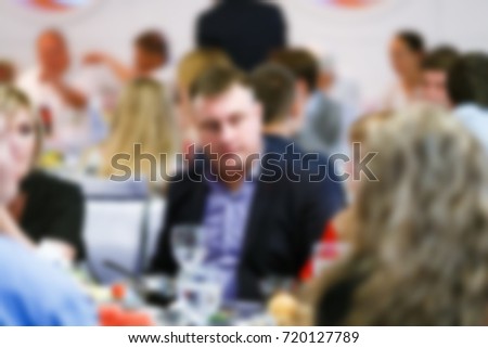 Blur people eating and talking in dining room, restaurant party celebration concept.