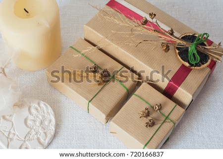 Christmas still life with eco friendly brown wrapping paper and gift packaging.