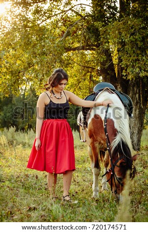 girl with horse on nature
