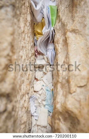 A fragment of the Western wall (Wailing wall or "Kotel") with notes to God in the Old city of Jerusalem, Israel. Tisha B'Av, Tisha beav, Yom Kippur, Atonement day, Jewish tradition