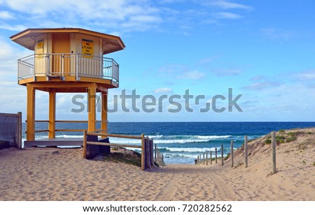 Yellow lifesavers hut and path leading onto Wanda Beach, Cronulla, New South Wales, Australia.