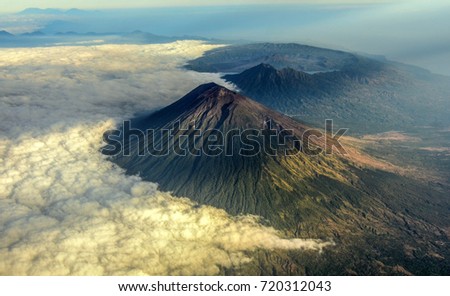 Mount Agung and the blanket of cloud with mount Abang and mount Batur in the Background Royalty-Free Stock Photo #720312043