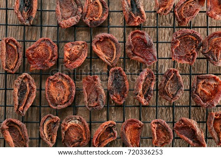 Dried apricots on metal grid