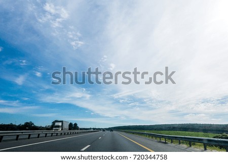 Photo of country road with cars