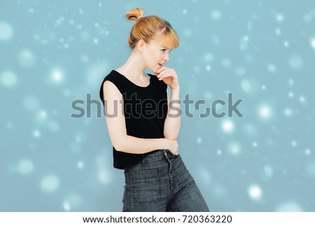 Happy beautiful woman girl model jeans black T-shirt posing smiling happy positive winter snow background