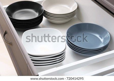 Plates in kitchen drawer