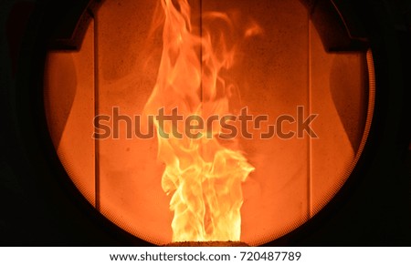 Burning fire in a stove. Fireplace flame. Warm concept. Fire shape. Fire silhouette. 