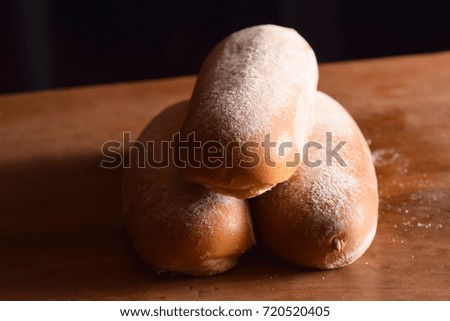 French Rolls on a Wooden Table