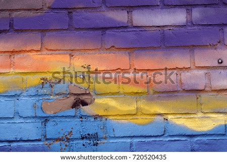 Orange, Blue, and Purple Spray Paint on Brick