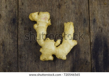 Ginger Over Wooden Background