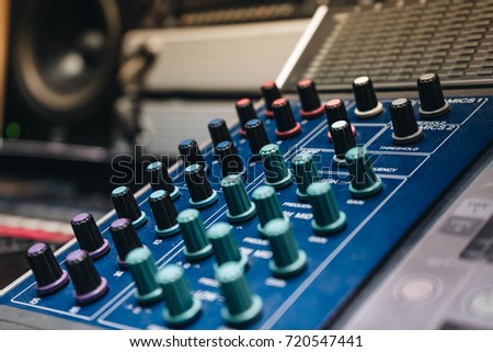 Mixer for sound engineer with many button to adjust in the control room of television broadcast. Mixdown  