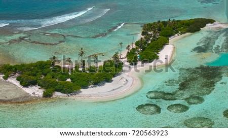 Aerial view wide with drone of picnic island or bikini beach in Guraidhoo with turquoise and green water, Maldives