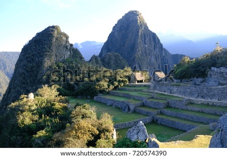 View from Machu Picchu archaeological site on mountain Huayna Picchu, early in the morning