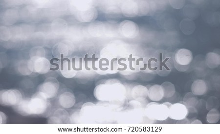 Beautiful abstract silver glittering lights bokeh background
