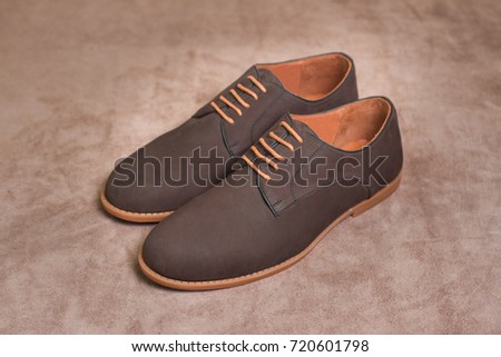 Leather shoes isolated on brown background -including clipping path