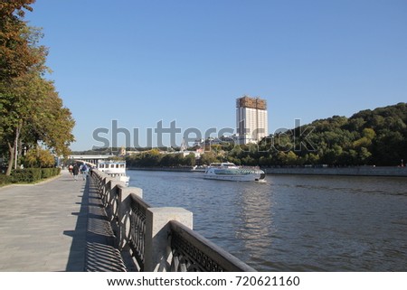 September city landscape: Moskva River embankment, riverboats on the background of the building of the Russian Academy of Sciences (popular name Golden Brain or Eau de cologne). Moscow. Russia