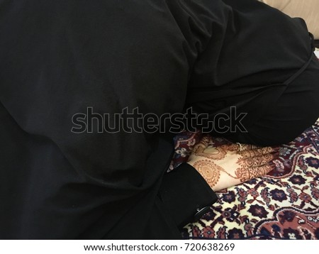 Young muslim islamic girl wearing hijab and pray